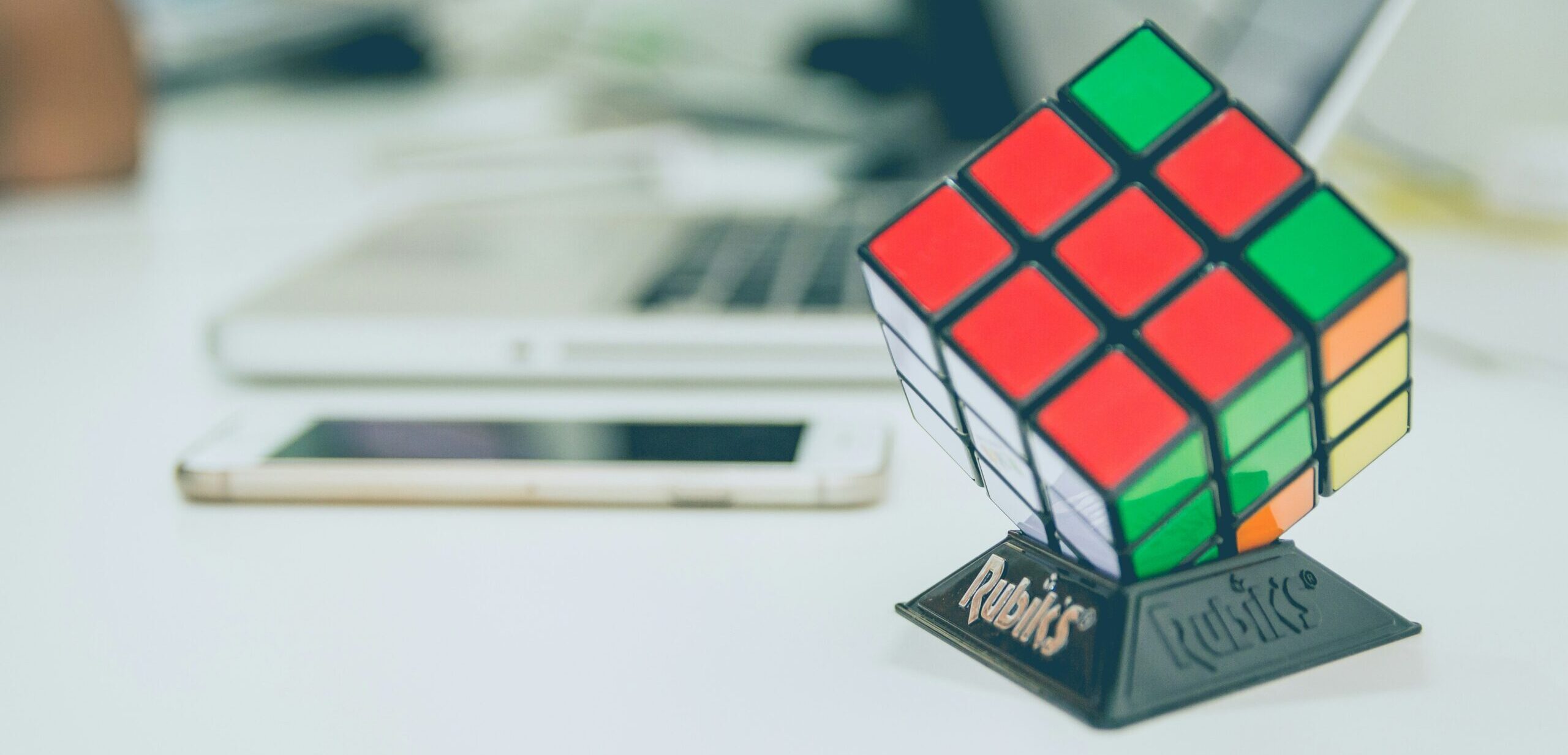 A Rubik's cube with only one side (the white) completed, representing the need for holistic data.