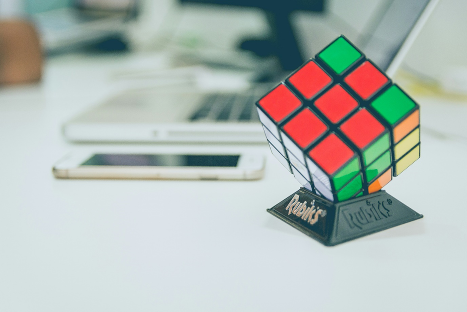 Image of a Rubik's cube with the white side completed and all the colourful tiles still in disarray. This is a useful way to visualise the challenges of diversity in the Age of AI.